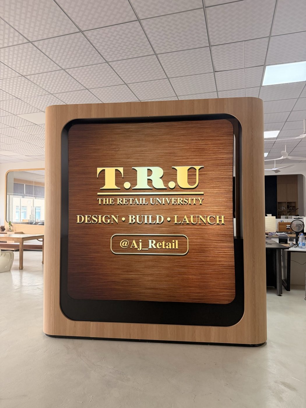The Retail University branded sign — Design, Build, Launch